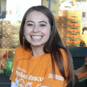 Girl smiling wearing Produce Rescue shirt