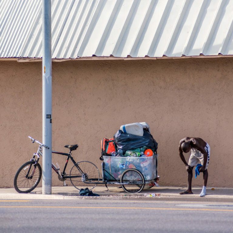 Bicycle street vendor taking a break in the heat