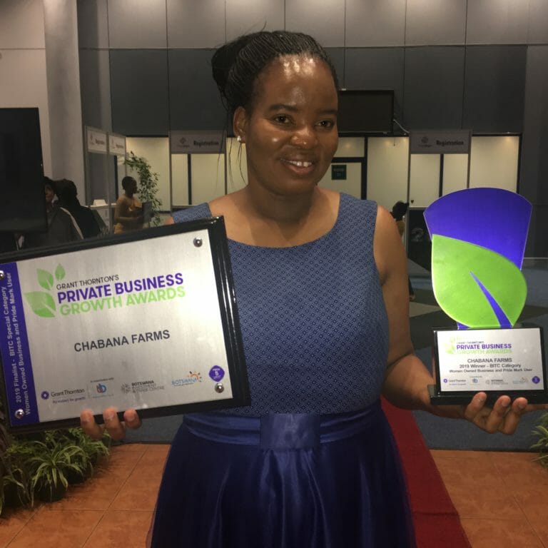 Mavis Nduchwa receiving award