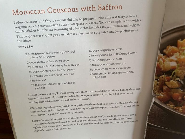 Cookbook open to Morracan couscous with saffron recipe