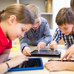 Children playing games on iPads
